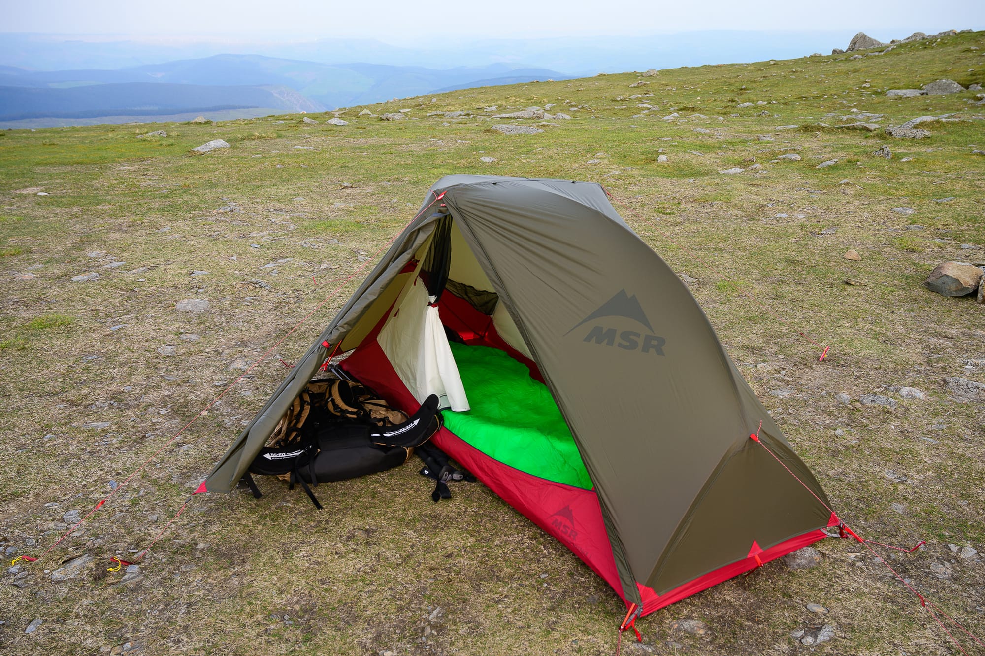 a pitched tent on an open plain